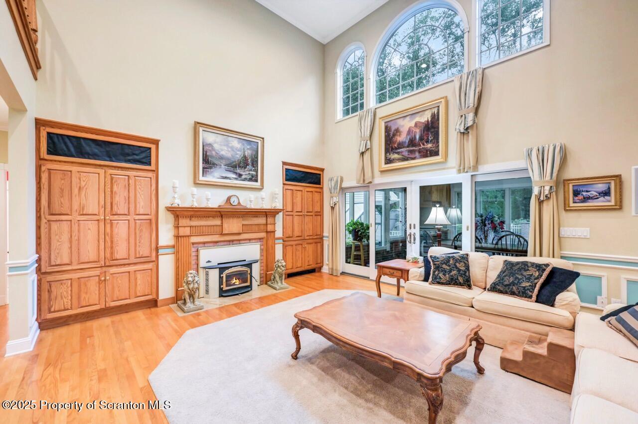 922 Old Logger Road Moscow, PA 18444 - Photo 15 of 93 a living room with furniture a fireplace and a flat screen tv