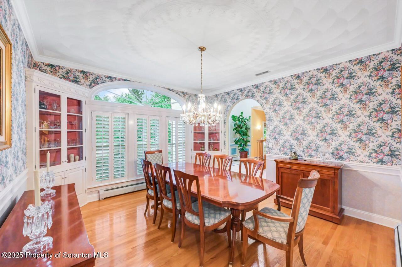 922 Old Logger Road Moscow, PA 18444 - Photo 32 of 93 a view of a dining room with furniture window and wooden floor