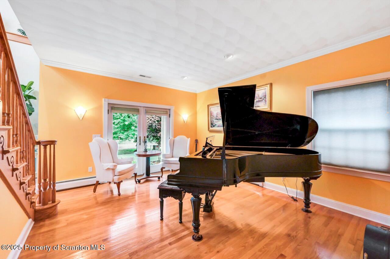 922 Old Logger Road Moscow, PA 18444 - Photo 35 of 93 a living room with furniture and a flat screen tv