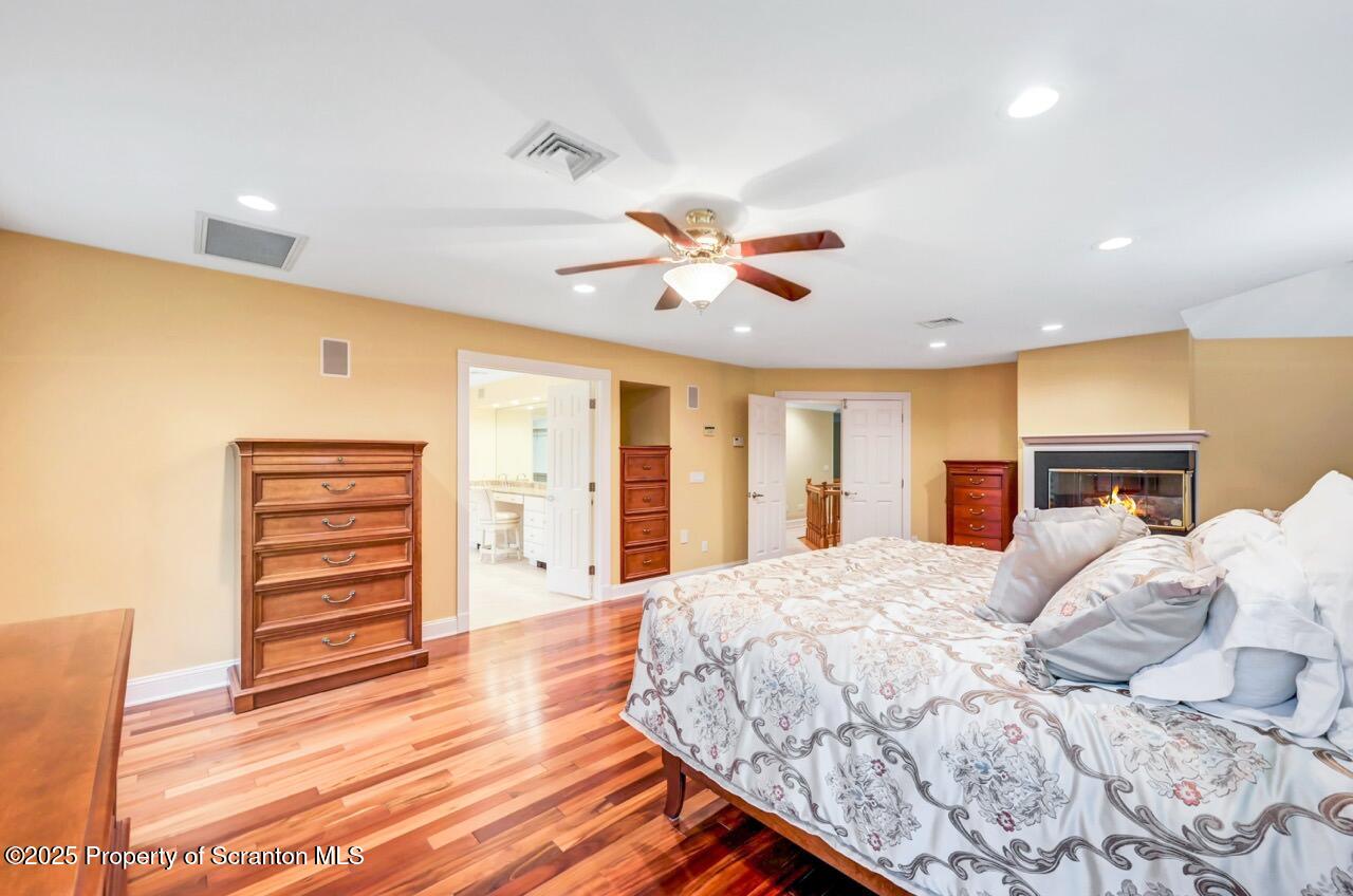 922 Old Logger Road Moscow, PA 18444 - Photo 50 of 93 a bed room with a bed and a ceiling fan