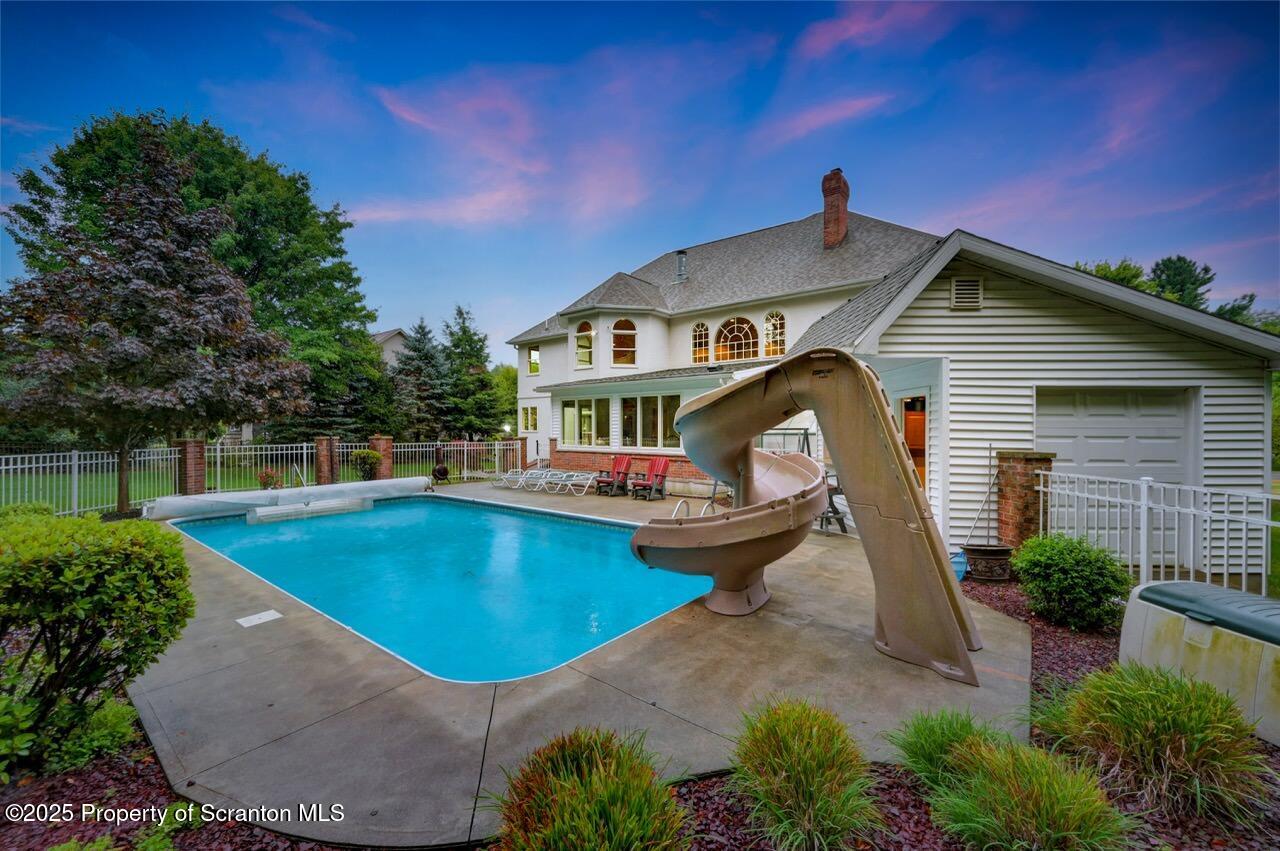 922 Old Logger Road Moscow, PA 18444 - Photo 5 of 93 a front view of a house with swimming pool yard and outdoor seating