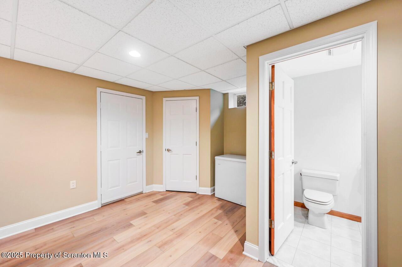 922 Old Logger Road Moscow, PA 18444 - Photo 77 of 93 a bathroom with a toilet sink and a mirror