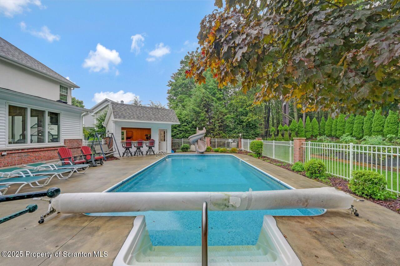 922 Old Logger Road Moscow, PA 18444 - Photo 84 of 93 a view of a house with swimming pool and sitting area