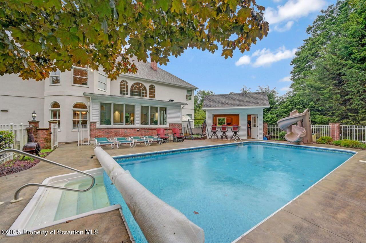922 Old Logger Road Moscow, PA 18444 - Photo 85 of 93 swimming pool view with plants and large trees