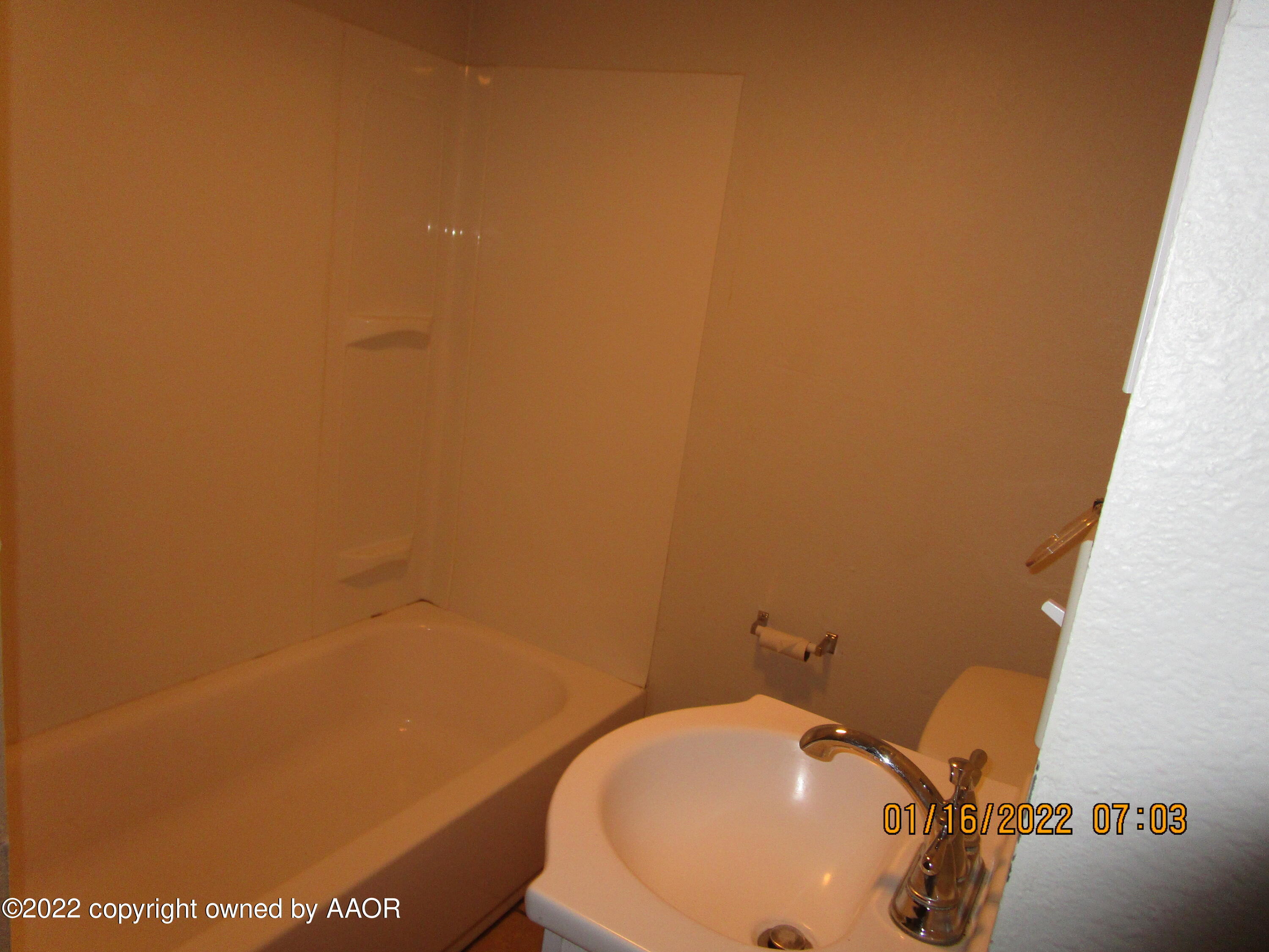 711 Wichita Avenue Amarillo, TX 79107 - Photo 5 of 6 a bathroom with a sink and a toilet