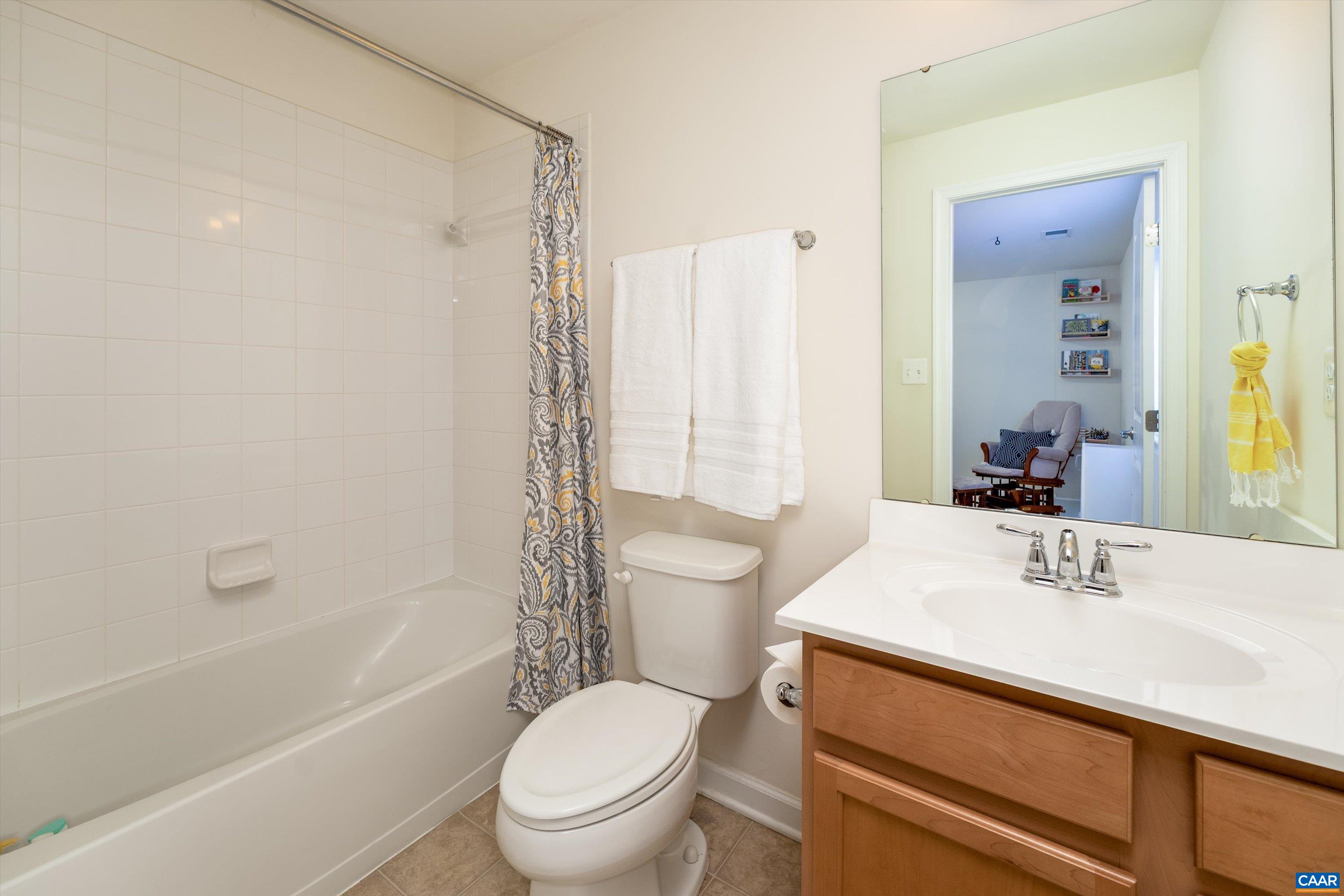 239 Pebble Beach Court Charlottesville, VA 22901 - Photo 12 of 57 a bathroom with a sink a toilet a mirror a vanity and shower