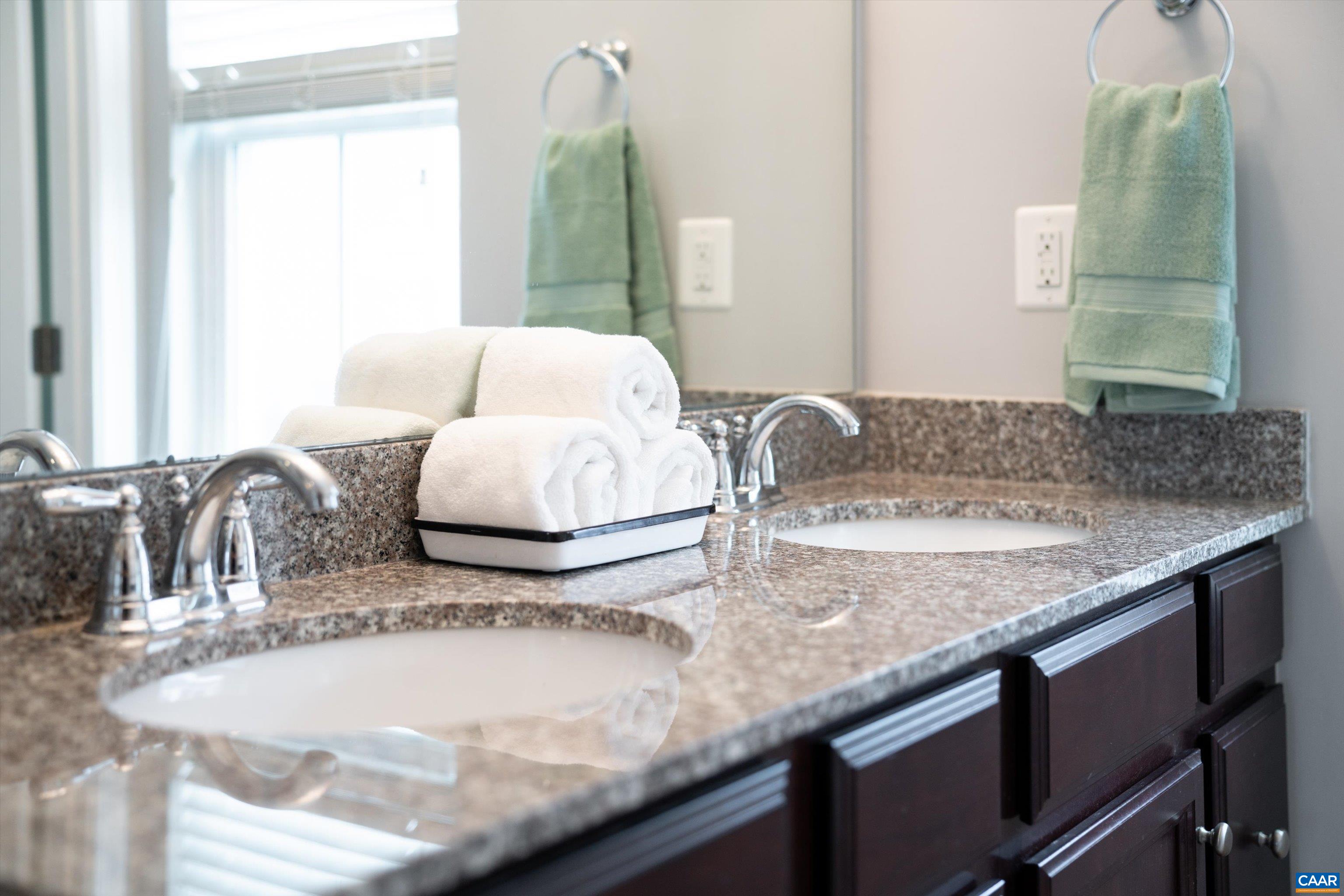239 Pebble Beach Court Charlottesville, VA 22901 - Photo 34 of 57 a bathroom with a granite countertop sink and a mirror