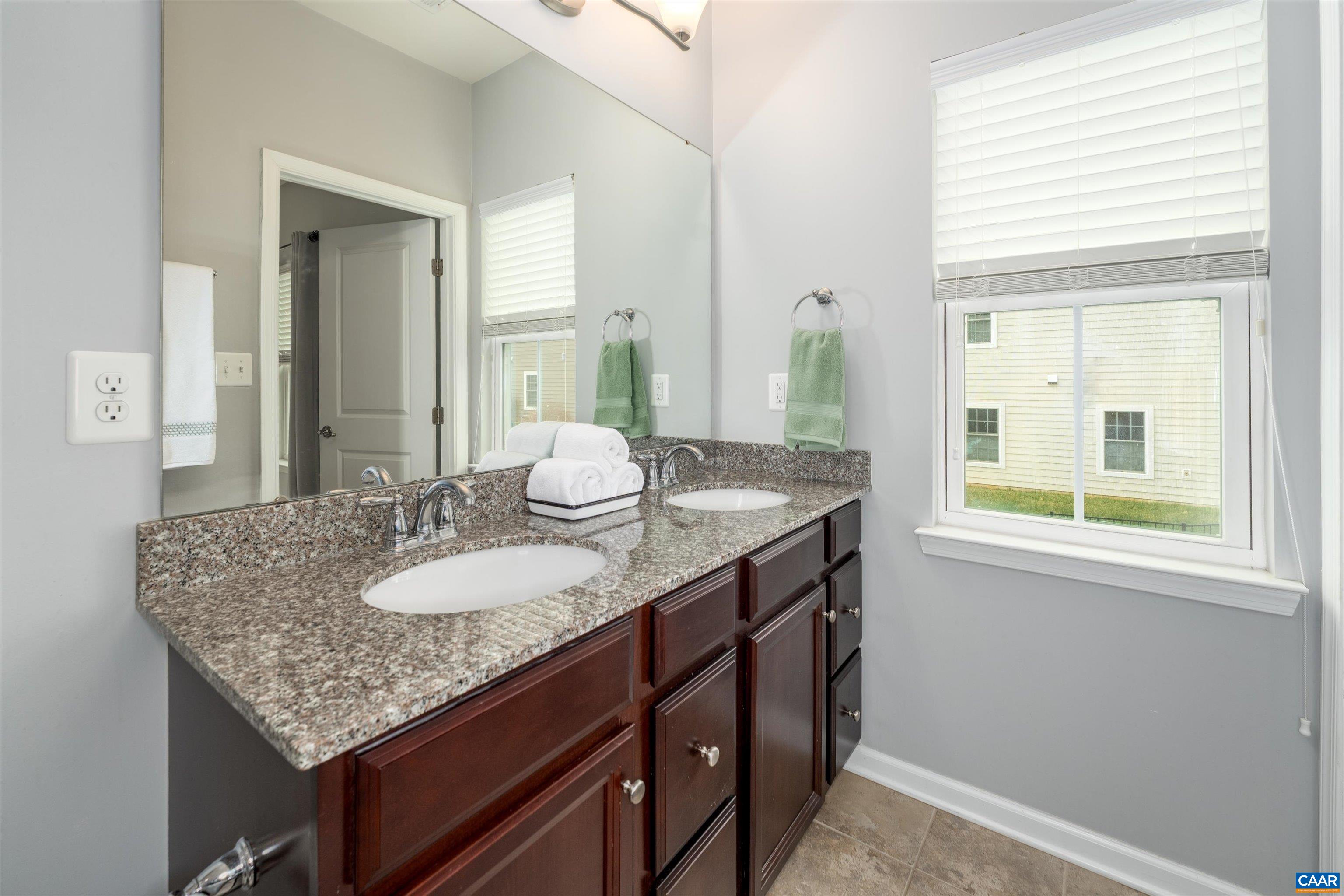 239 Pebble Beach Court Charlottesville, VA 22901 - Photo 35 of 57 a bathroom with a granite countertop sink and a mirror