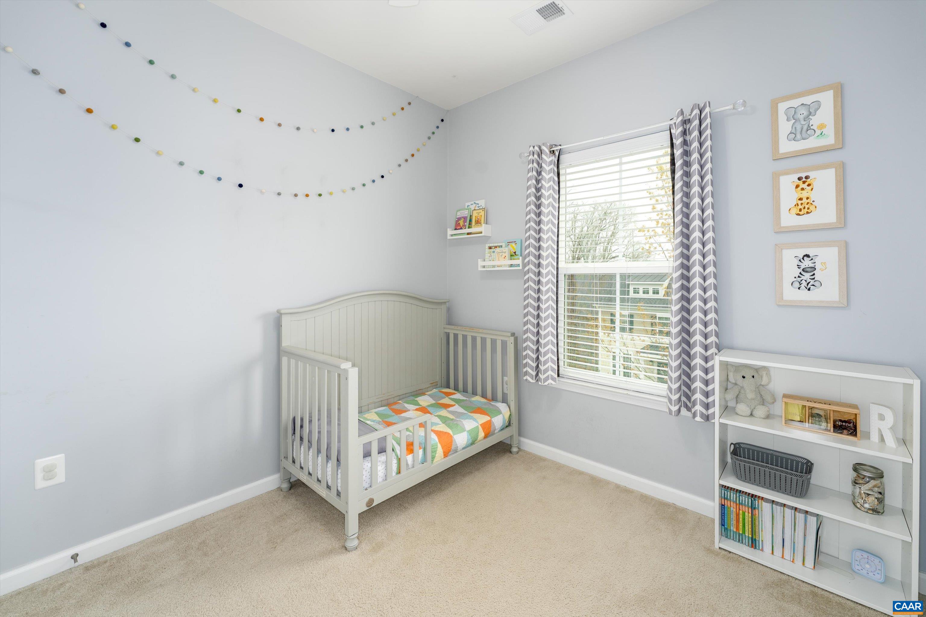 239 Pebble Beach Court Charlottesville, VA 22901 - Photo 6 of 57 a bed sitting in a bedroom next to a window