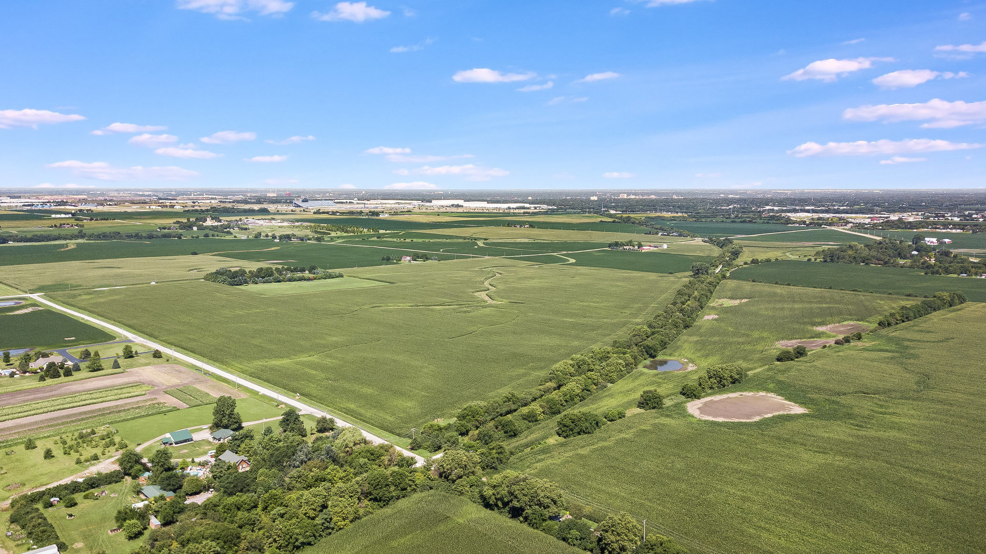 1111 West Baker Road Manhattan, IL 60442 - Photo 3 of 6 a view of a lake with a outdoor space