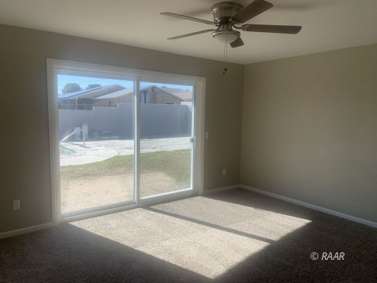 227 South Desert Candles Street Ridgecrest, CA 93555 - Photo 11 of 26 an empty room with a window
