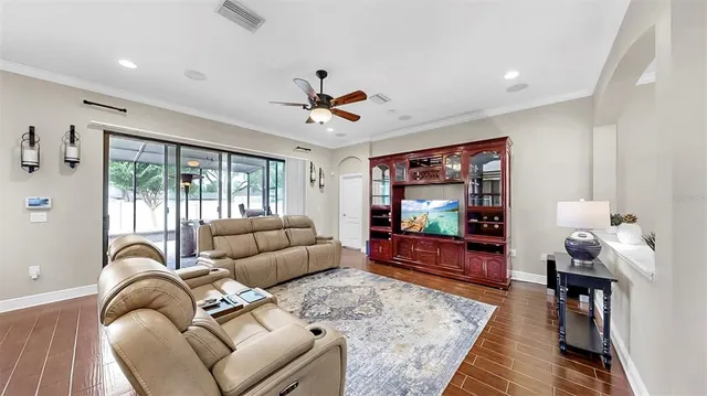 a view of a dining room with furniture and wooden floor