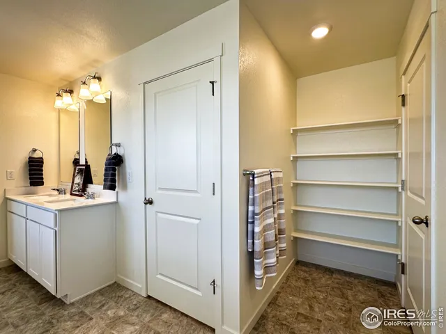 a view of a bathroom with a sink and mirror
