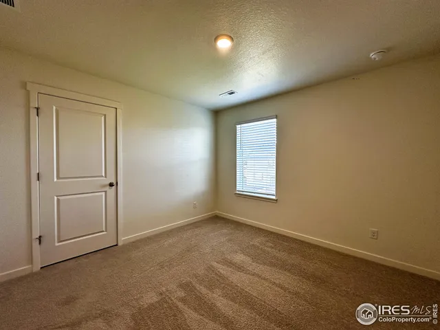 a bathroom with a double vanity sink toilet mirror and shower