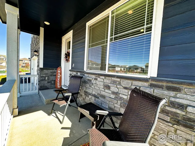 a view of a chairs and table in the balcony