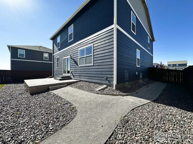 a view of front door of house with yard