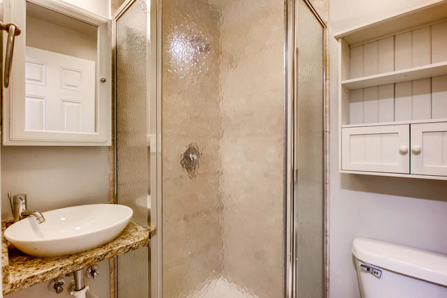 702 Reba Place, Unit G2 Evanston, IL 60202 - Photo 11 of 12 a bathroom with a sink a toilet a mirror and shower