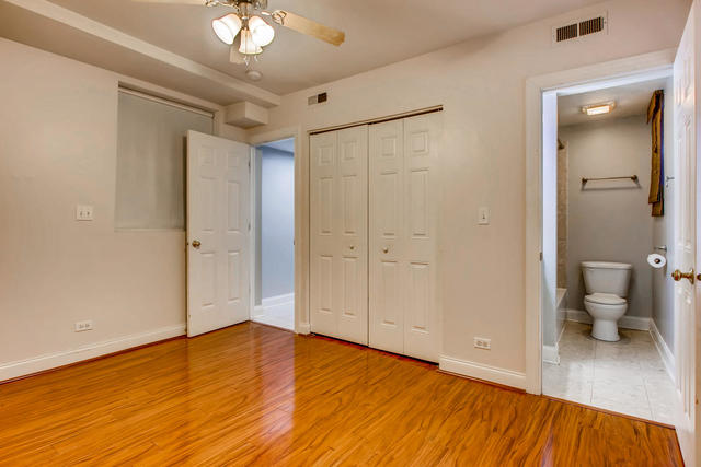 702 Reba Place, Unit G2 Evanston, IL 60202 - Photo 12 of 12 a view of a room with wooden floor and a toilet