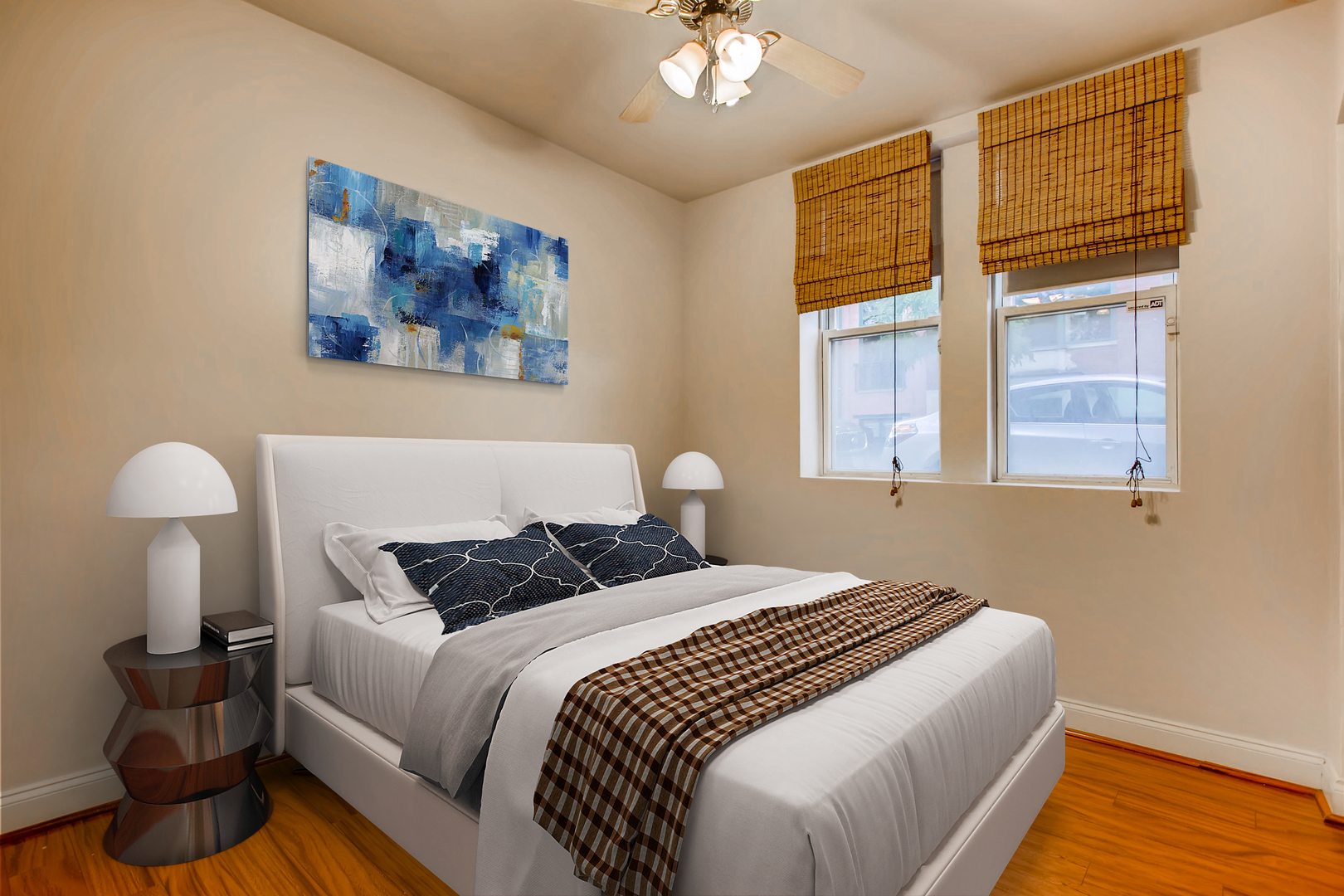 702 Reba Place, Unit G2 Evanston, IL 60202 - Photo 4 of 12 a bedroom with a bed and wooden floor