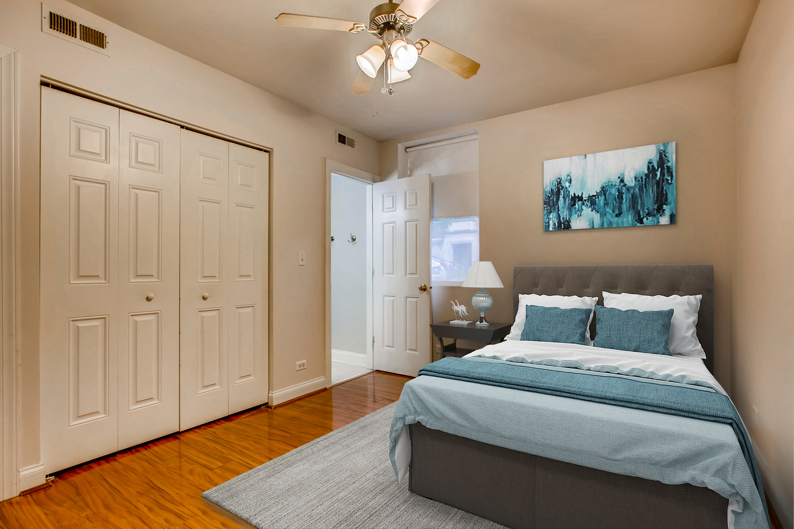 702 Reba Place, Unit G2 Evanston, IL 60202 - Photo 5 of 12 a bedroom with a bed and a chandelier