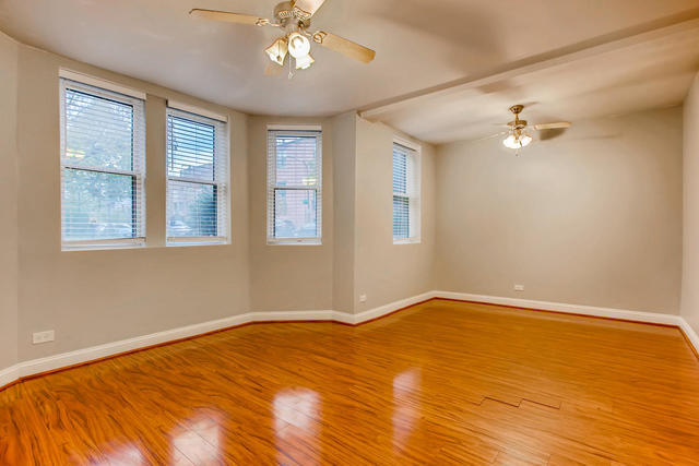 702 Reba Place, Unit G2 Evanston, IL 60202 - Photo 10 of 12 a view of an empty room with a chandelier fan