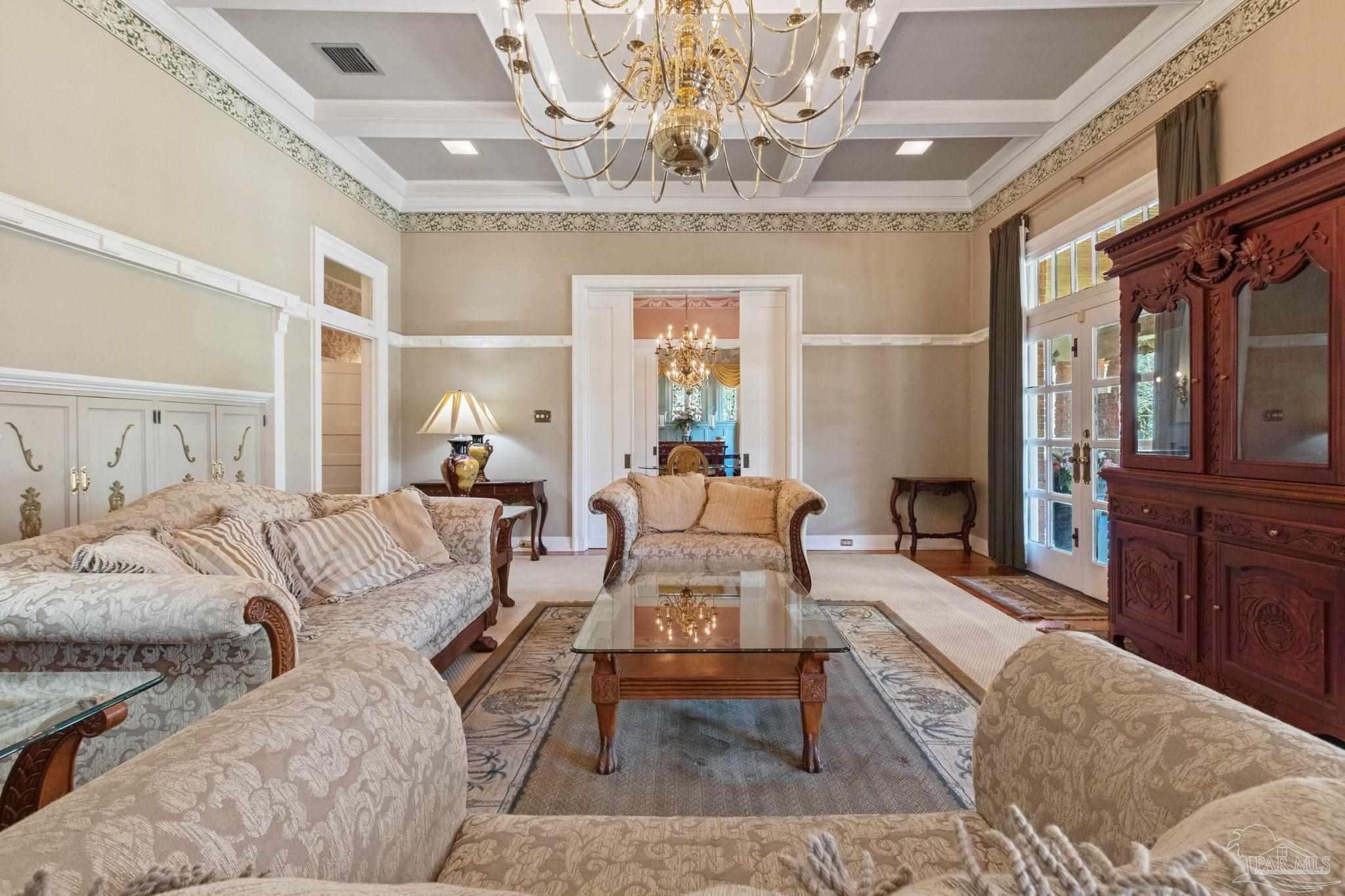 1701 Sowell Road Brewton, AL 36426 - Photo 23 of 72 a living room with furniture and a chandelier