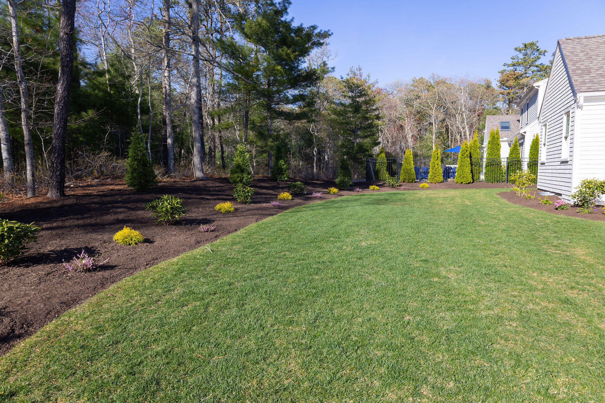 55 Blue Castle Drive Mashpee, MA 02649 - Photo 11 of 52 a view of a park with swings and slides