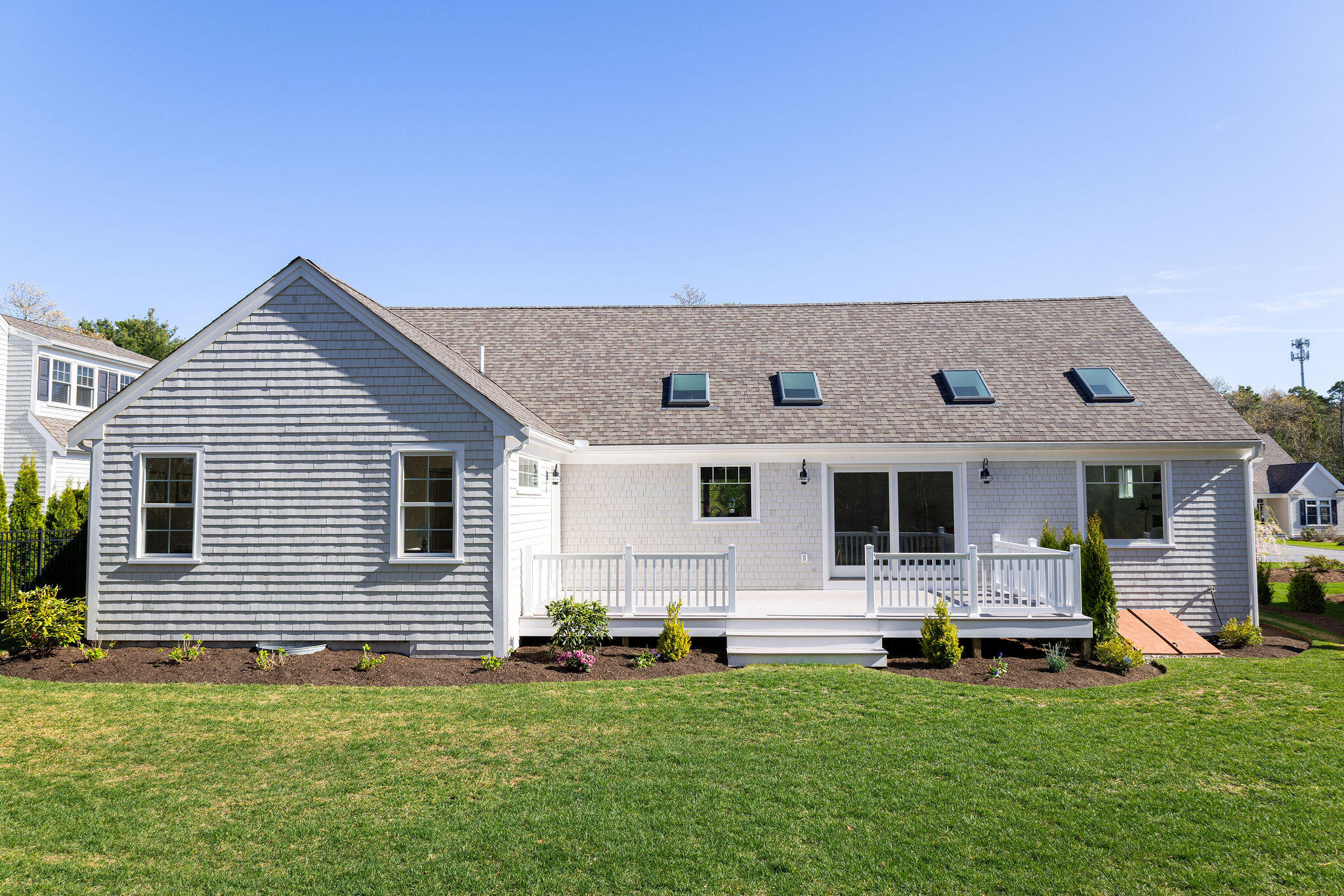 55 Blue Castle Drive Mashpee, MA 02649 - Photo 13 of 52 a backyard of a house with table and chairs