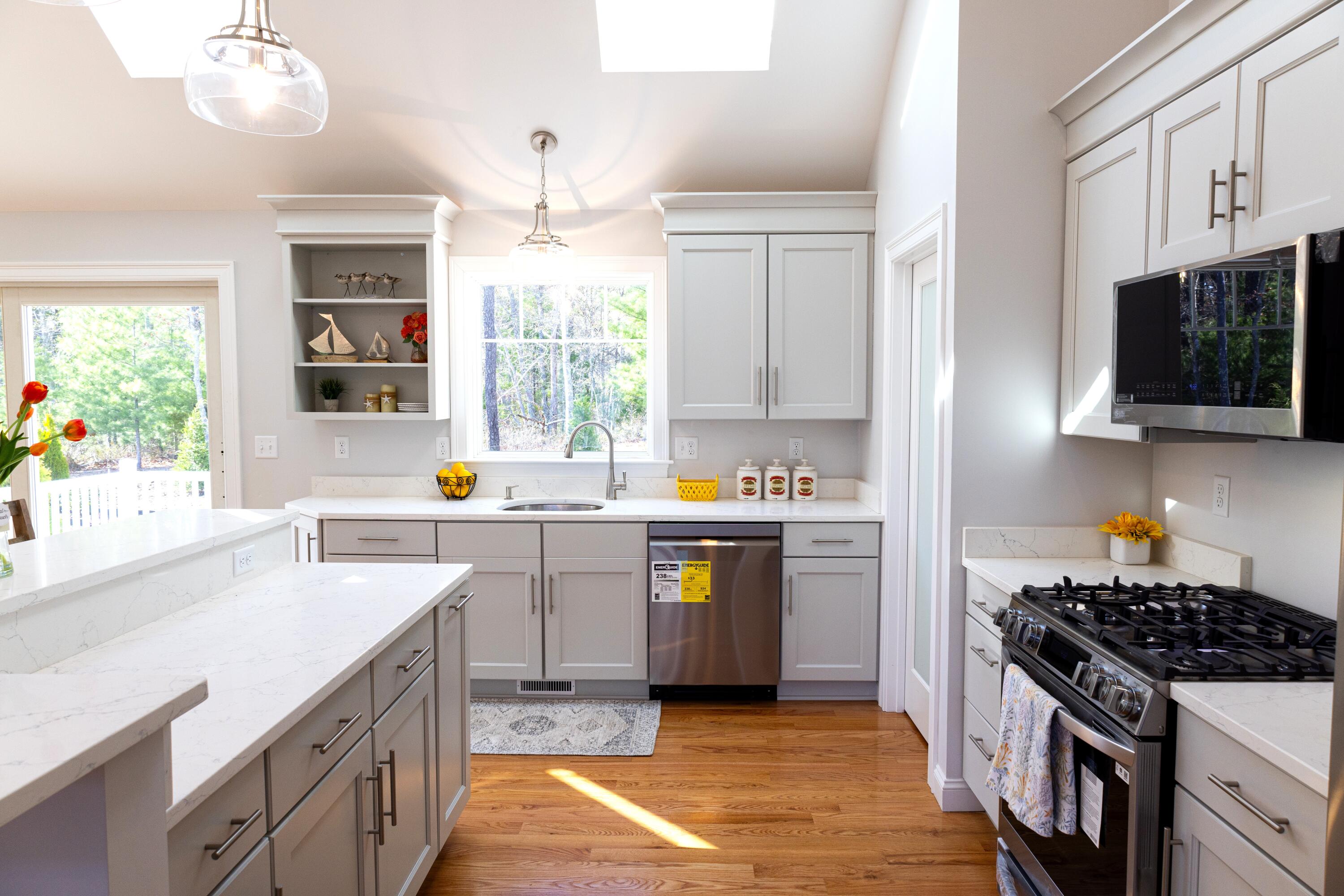 55 Blue Castle Drive Mashpee, MA 02649 - Photo 19 of 52 a kitchen with a sink stove top oven and refrigerator