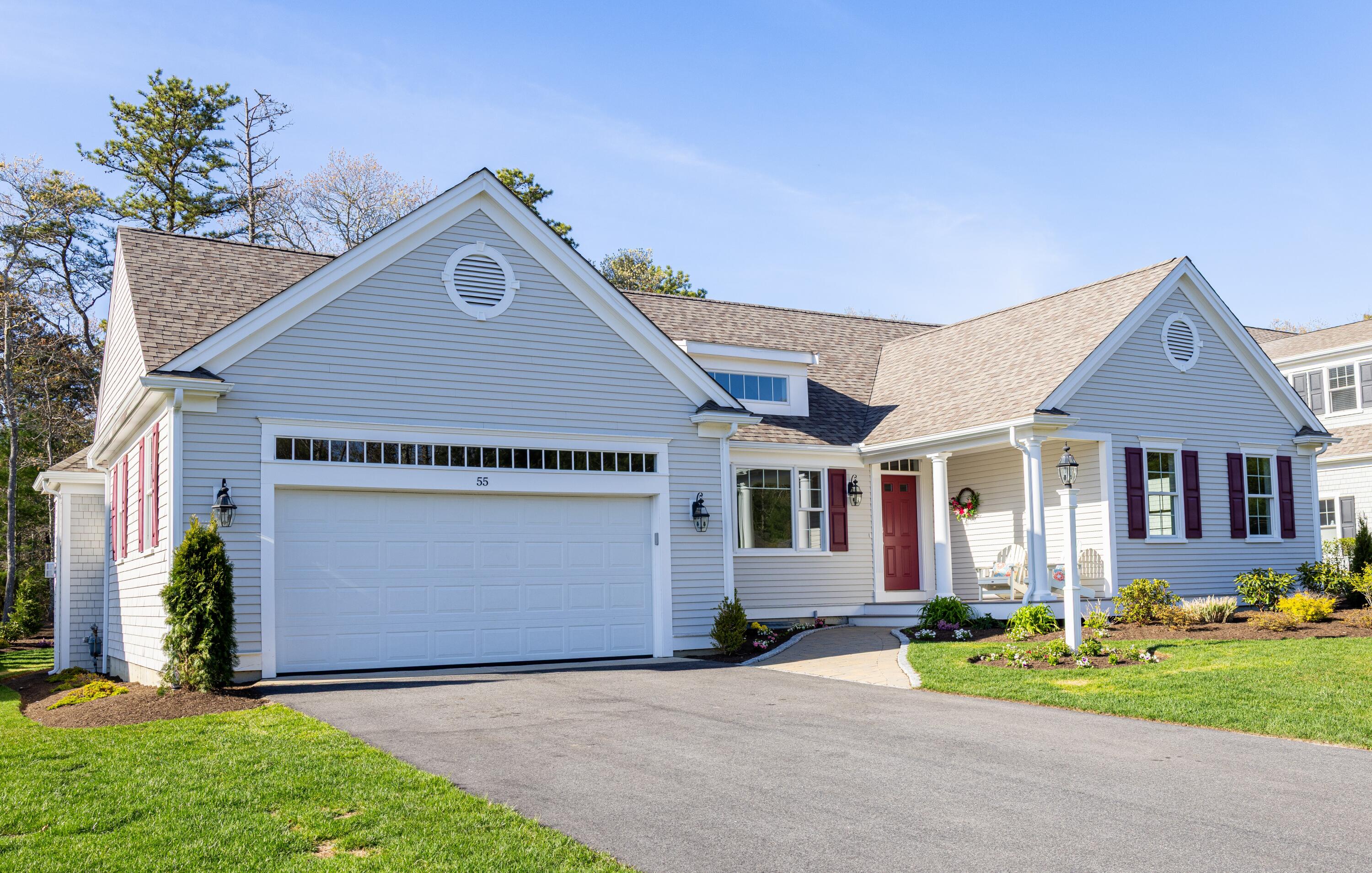 55 Blue Castle Drive Mashpee, MA 02649 - Photo 2 of 52 a front view of house with yard and green space