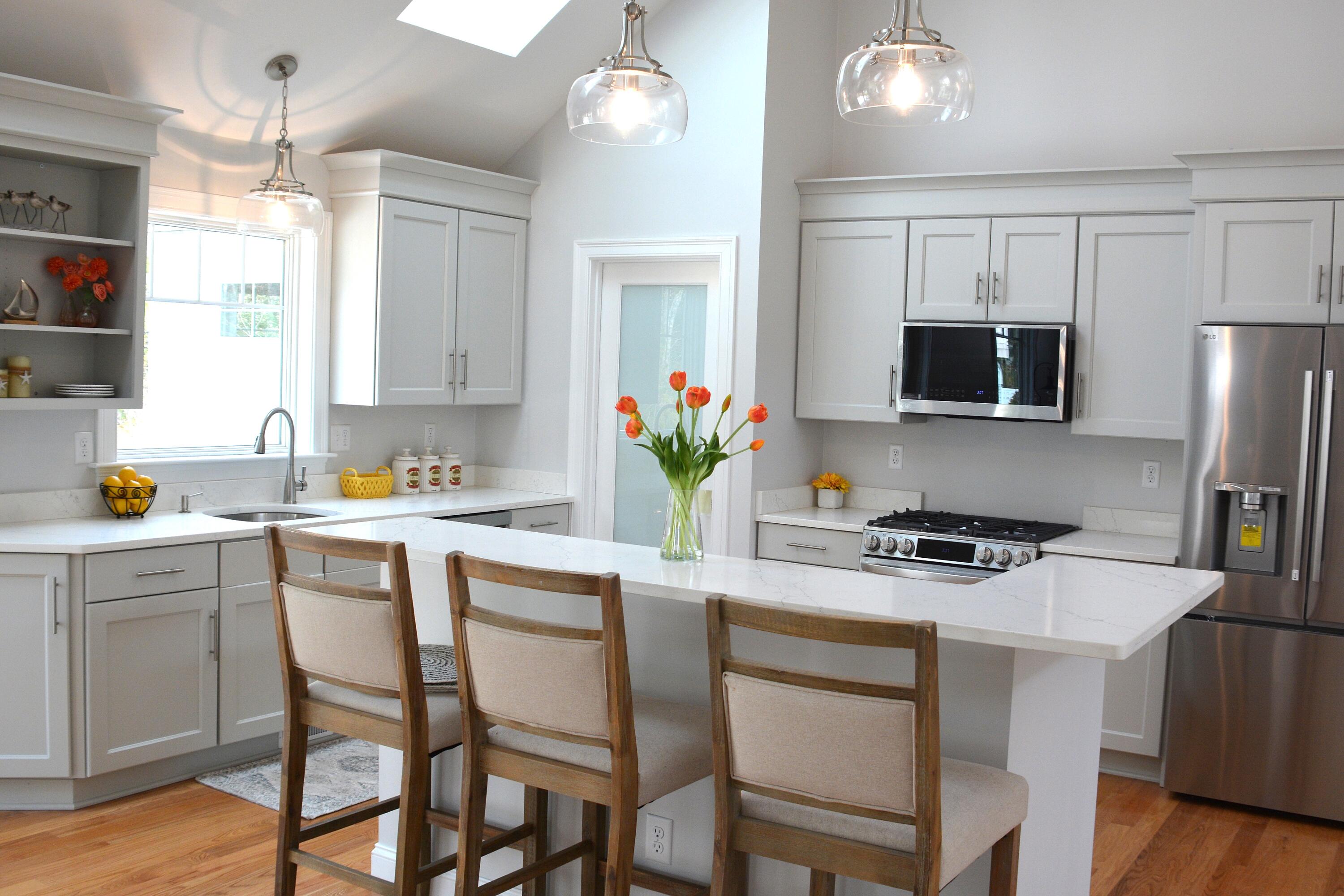 55 Blue Castle Drive Mashpee, MA 02649 - Photo 21 of 52 a kitchen with a dining table cabinets appliances and a window