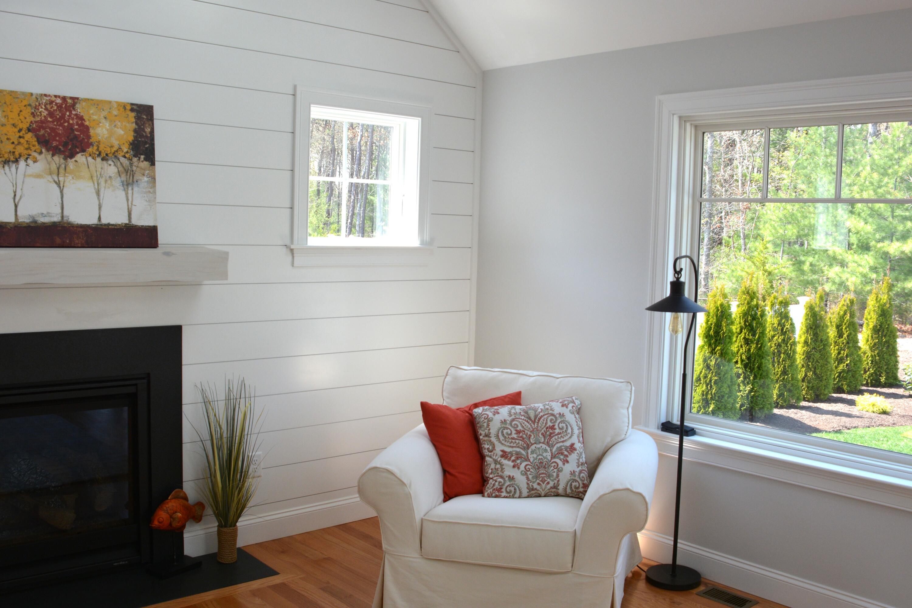55 Blue Castle Drive Mashpee, MA 02649 - Photo 28 of 52 a living room with furniture and a fireplace