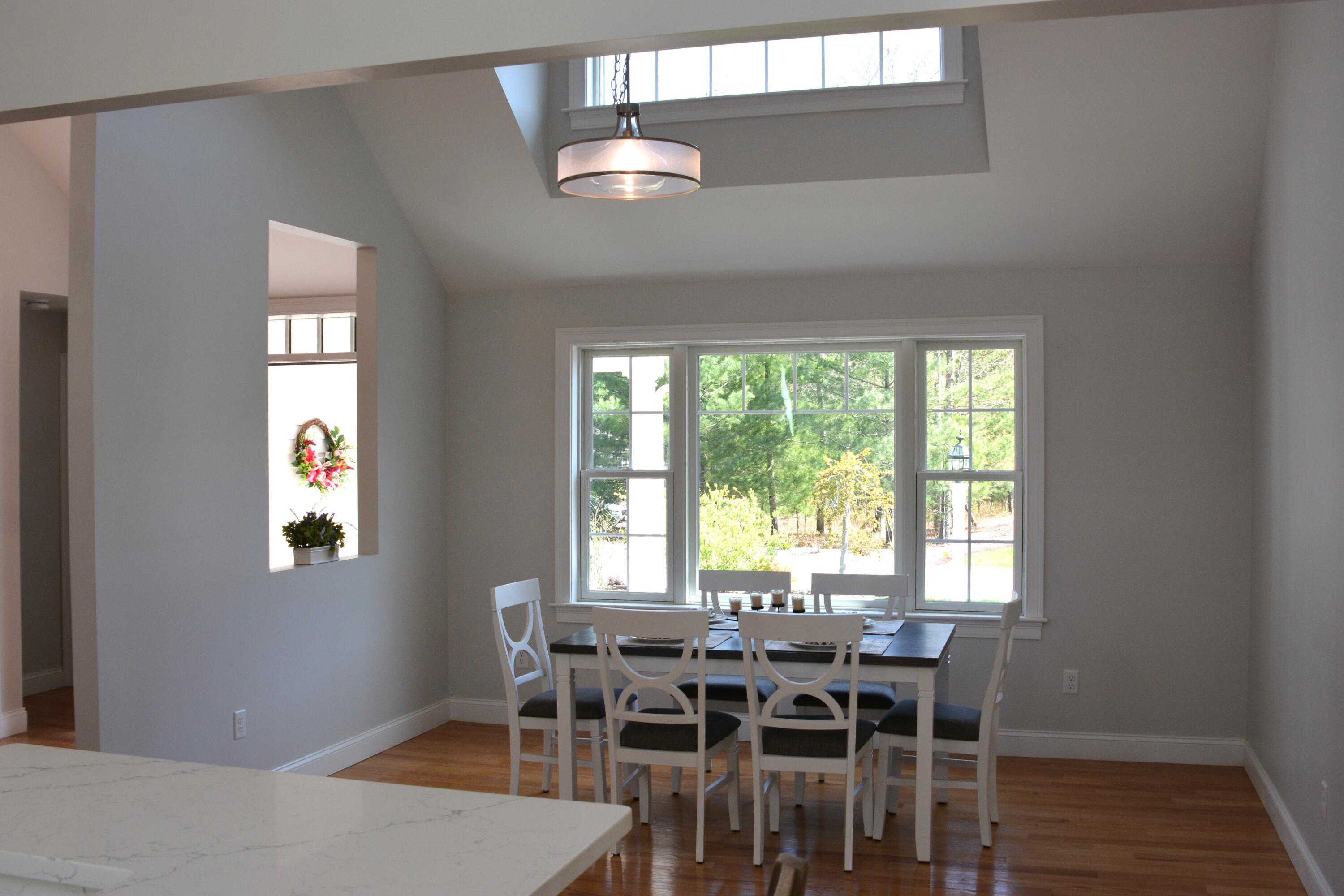 55 Blue Castle Drive Mashpee, MA 02649 - Photo 30 of 52 a view of a dining room with furniture and wooden floor
