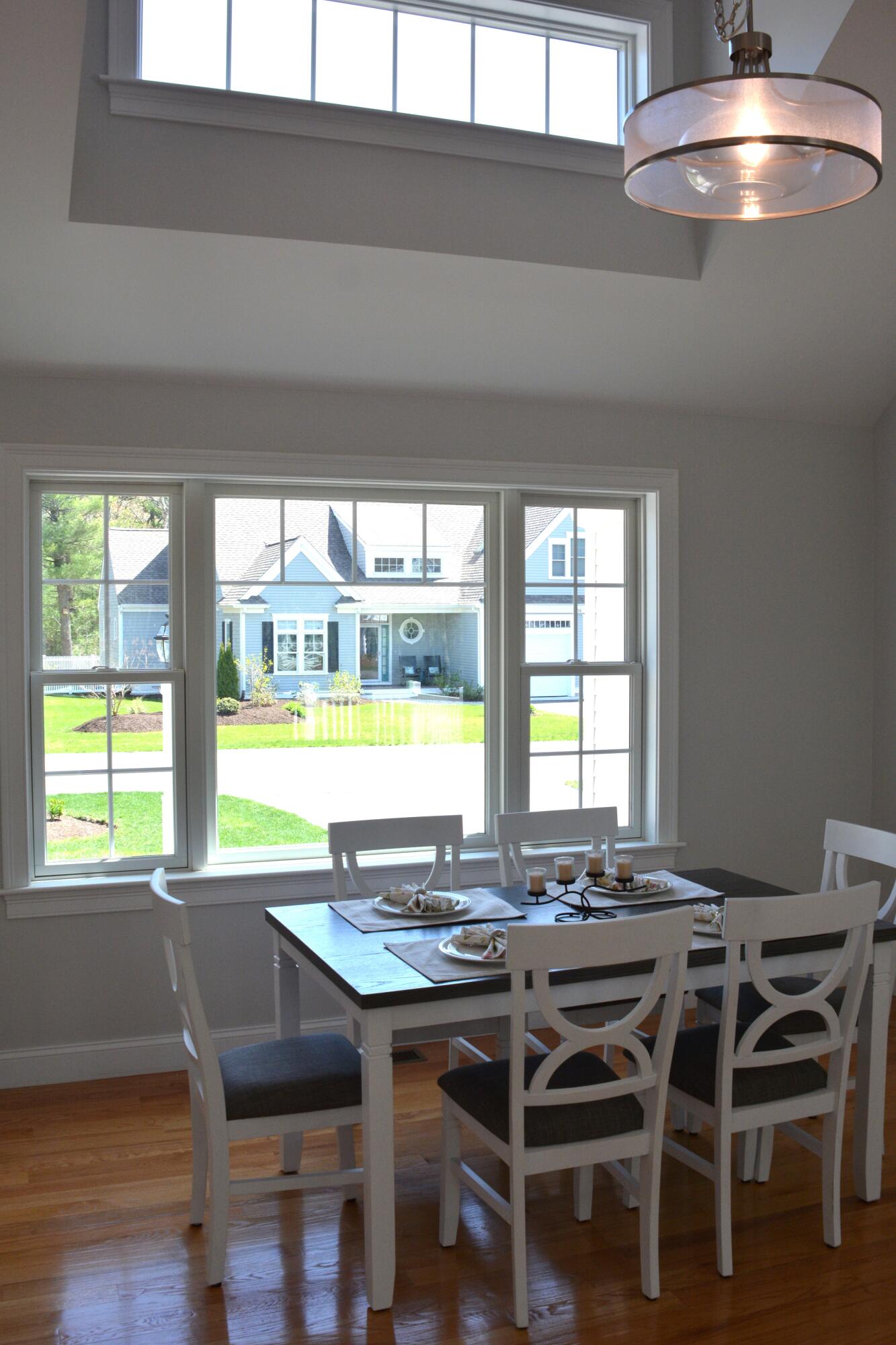 55 Blue Castle Drive Mashpee, MA 02649 - Photo 31 of 52 a view of a dining room with furniture window and outside view