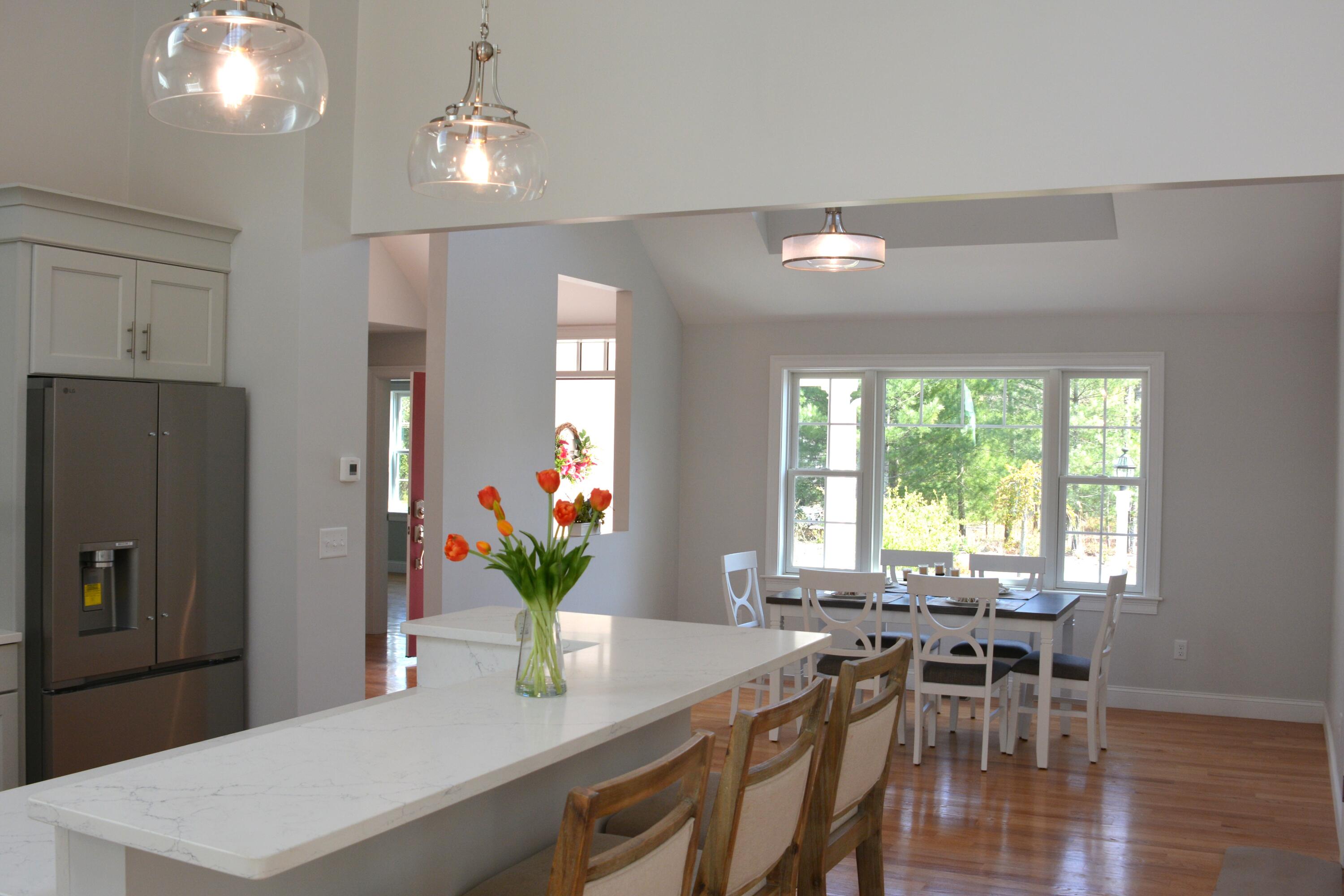 55 Blue Castle Drive Mashpee, MA 02649 - Photo 32 of 52 a dining room with furniture and wooden floor
