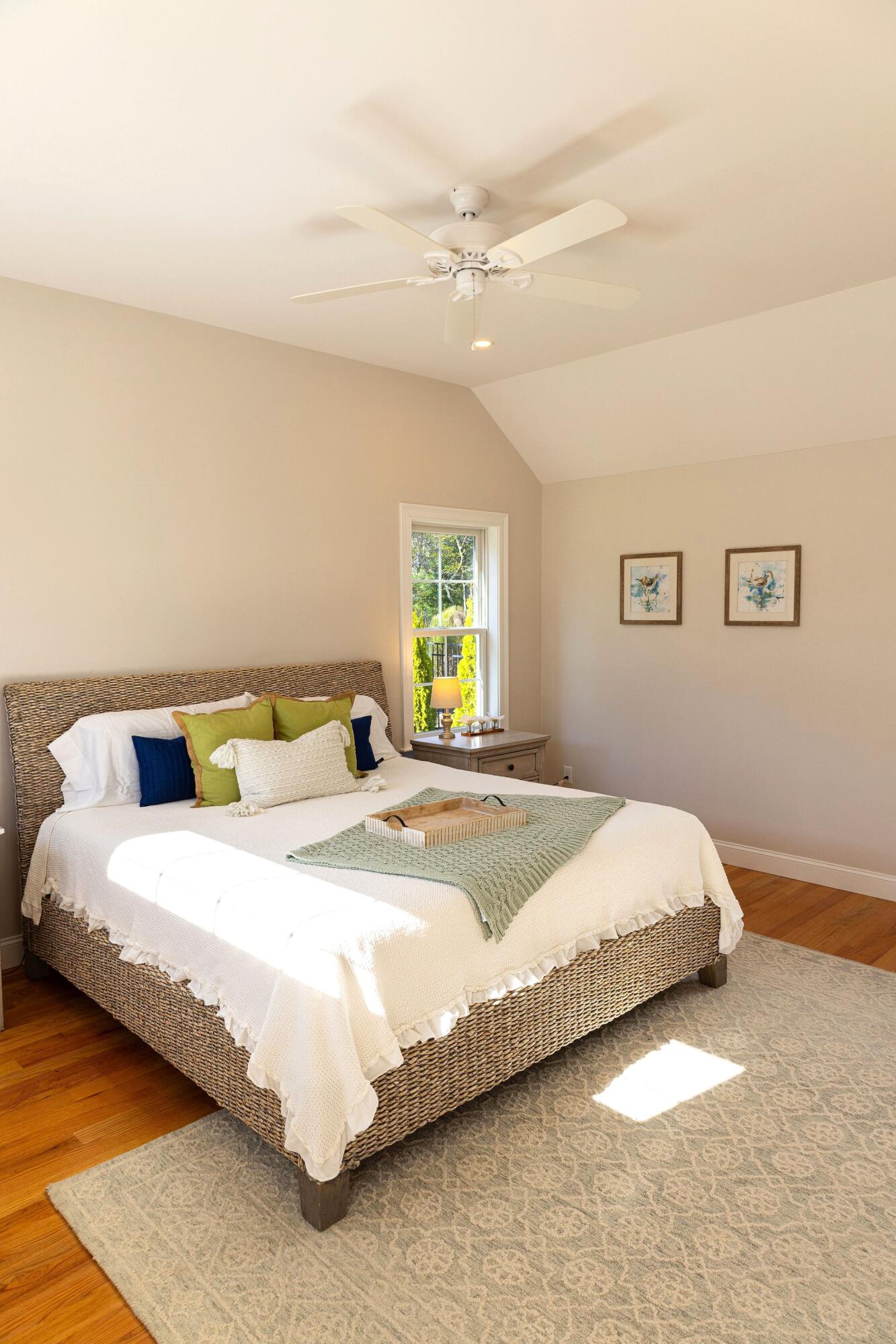 55 Blue Castle Drive Mashpee, MA 02649 - Photo 36 of 52 a bedroom with a bed and a chandelier