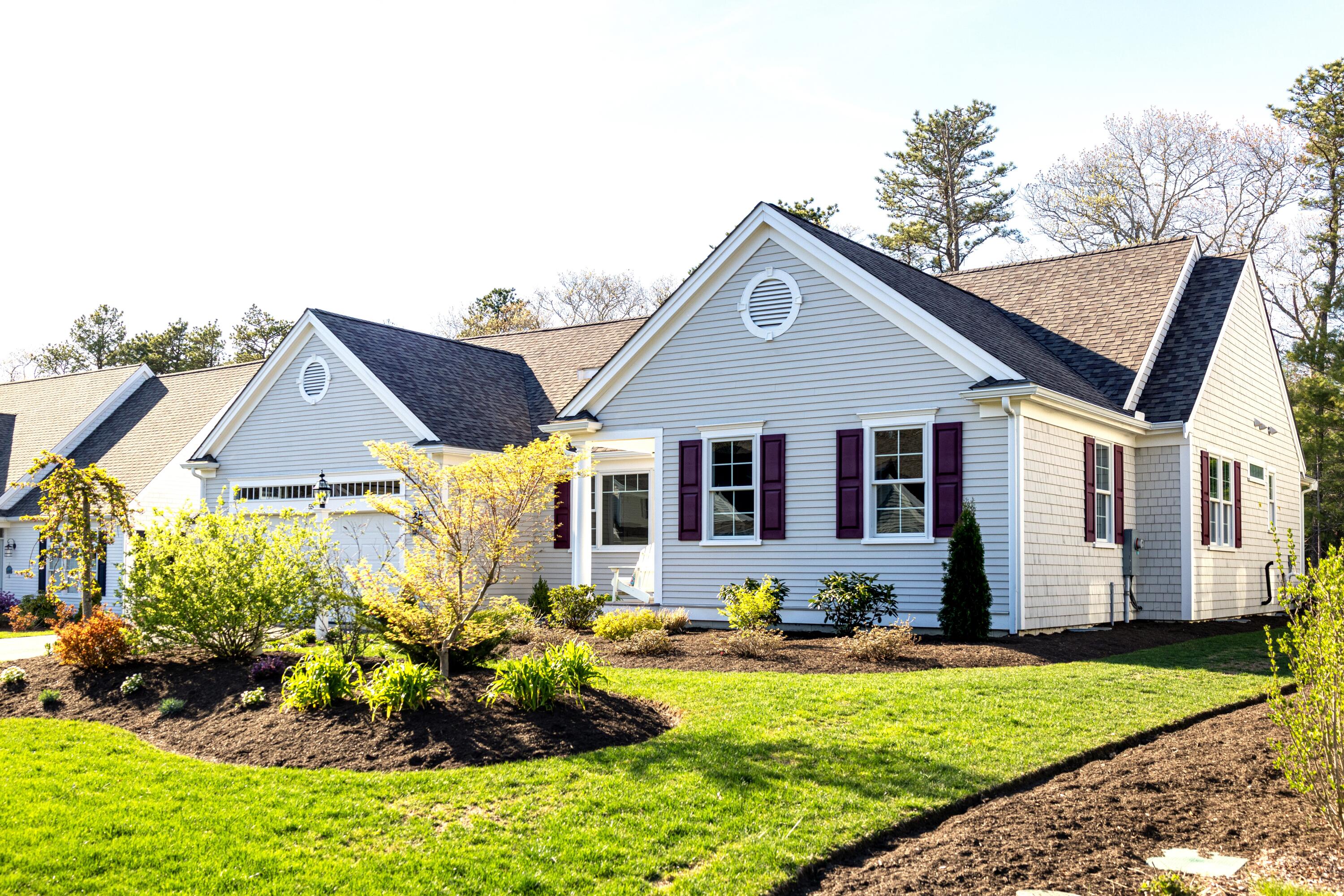 55 Blue Castle Drive Mashpee, MA 02649 - Photo 4 of 52 a front view of house with yard outdoor seating and barbeque oven