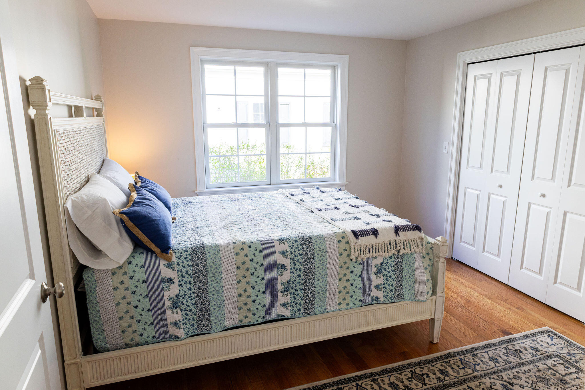 55 Blue Castle Drive Mashpee, MA 02649 - Photo 43 of 52 a bedroom with a bed and wooden floor