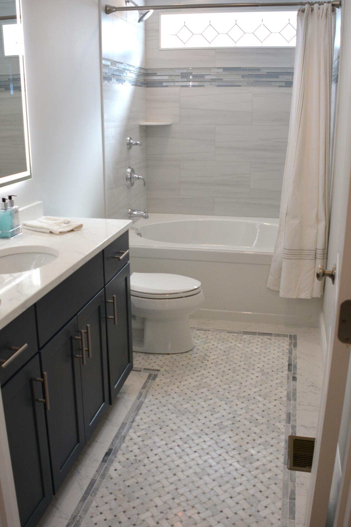 55 Blue Castle Drive Mashpee, MA 02649 - Photo 45 of 52 a bathroom with a sink a toilet and shower