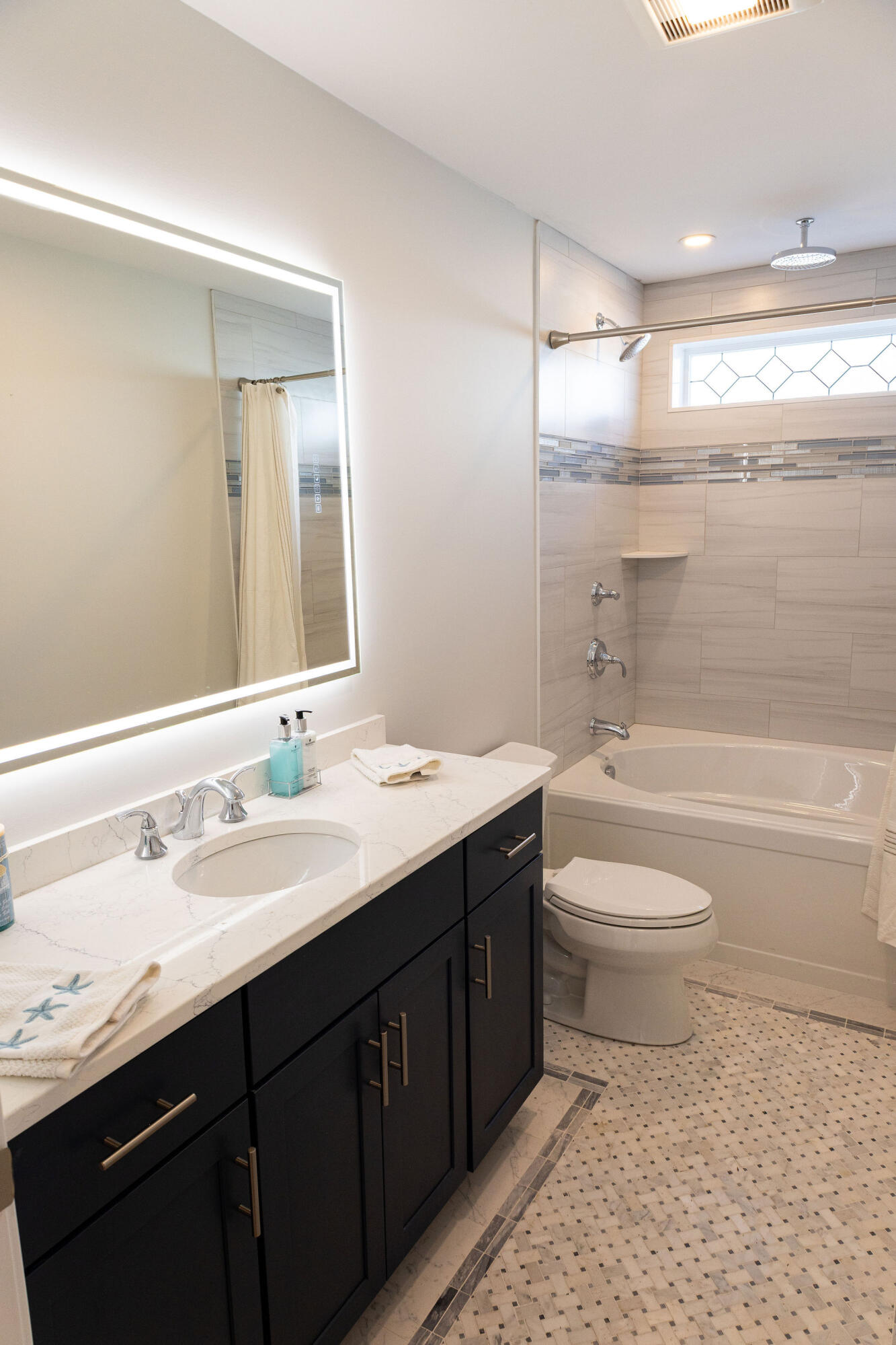 55 Blue Castle Drive Mashpee, MA 02649 - Photo 46 of 52 a bathroom with a toilet a sink a tub and mirror
