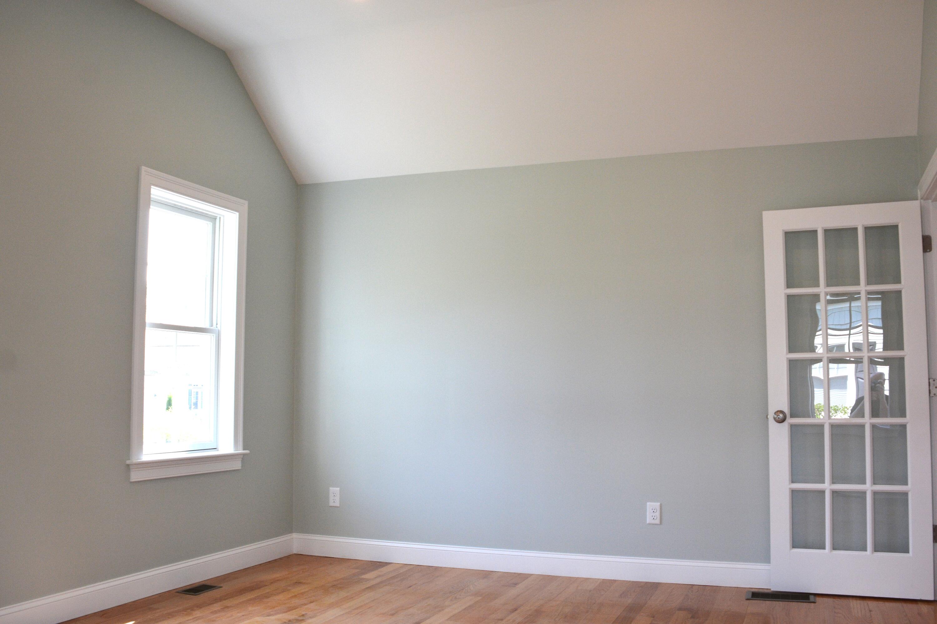 55 Blue Castle Drive Mashpee, MA 02649 - Photo 49 of 52 an empty room with wooden floor and windows