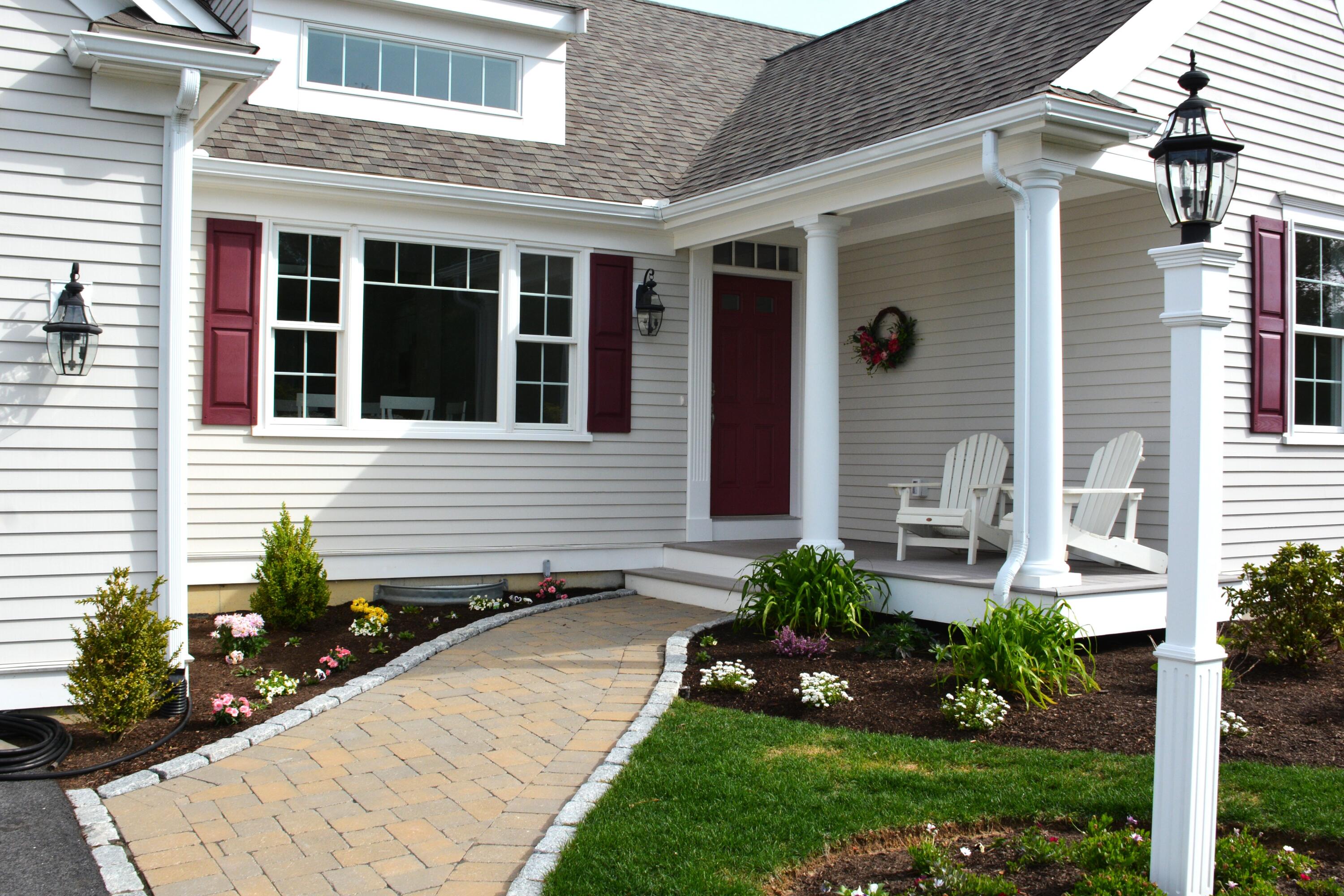 55 Blue Castle Drive Mashpee, MA 02649 - Photo 7 of 52 a front view of a house with a yard