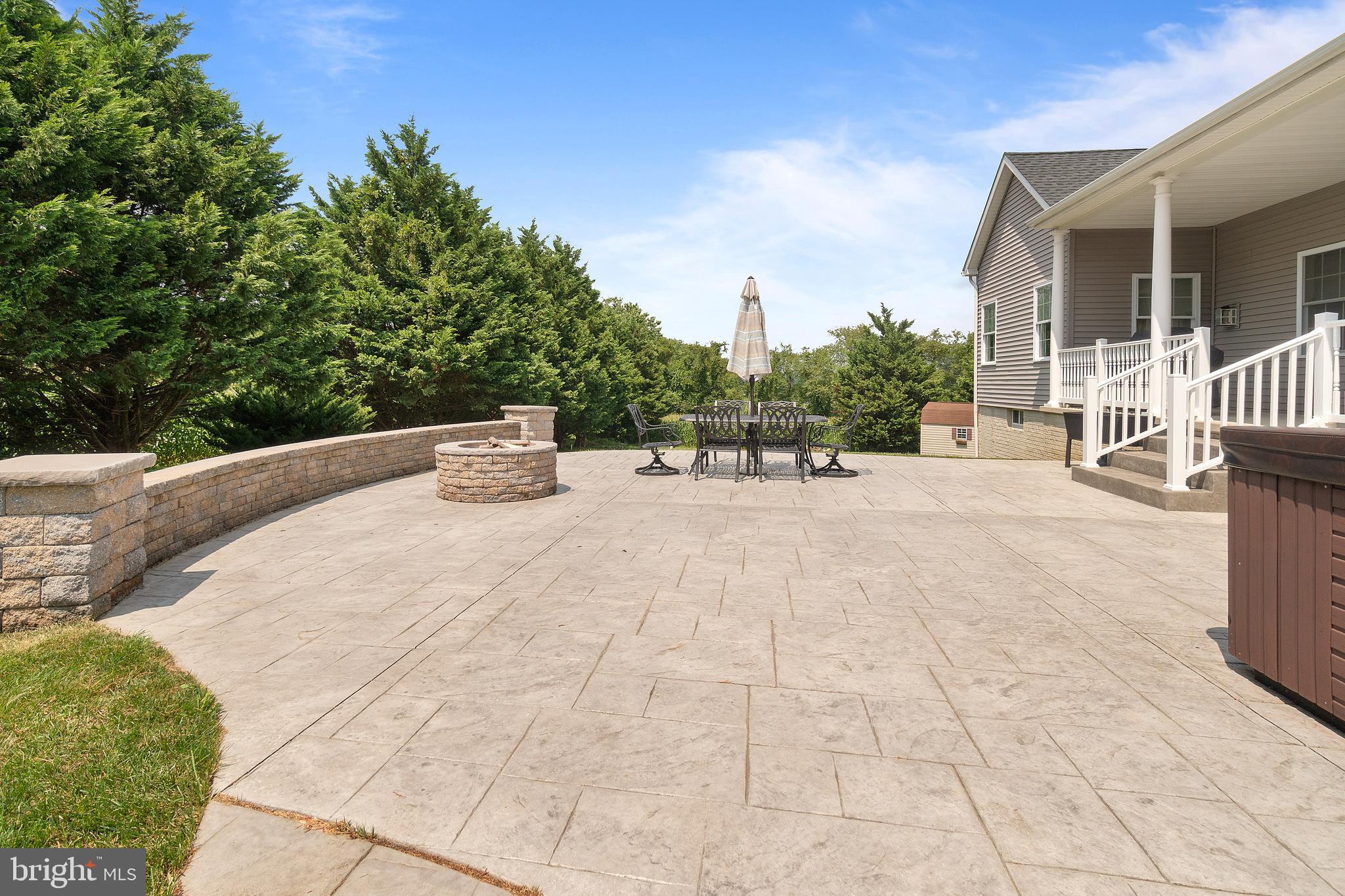 1424 Hopewell Road Port Deposit, MD 21904 - Photo 38 of 44 Stamped concrete patio with hot tub and fire pit.