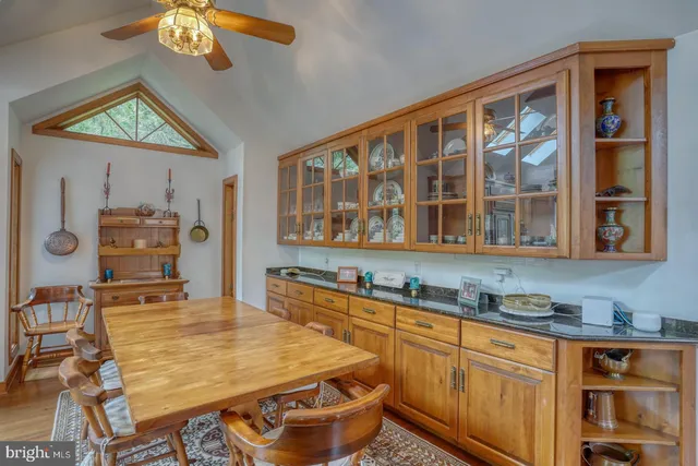 a dining room with furniture window wooden floor and front door