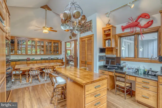 a bedroom with a bed and large window