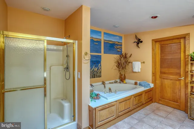 a view of a dining room with furniture a chandelier and wooden floor
