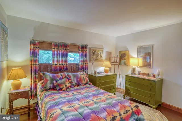 a view of a backyard with large trees