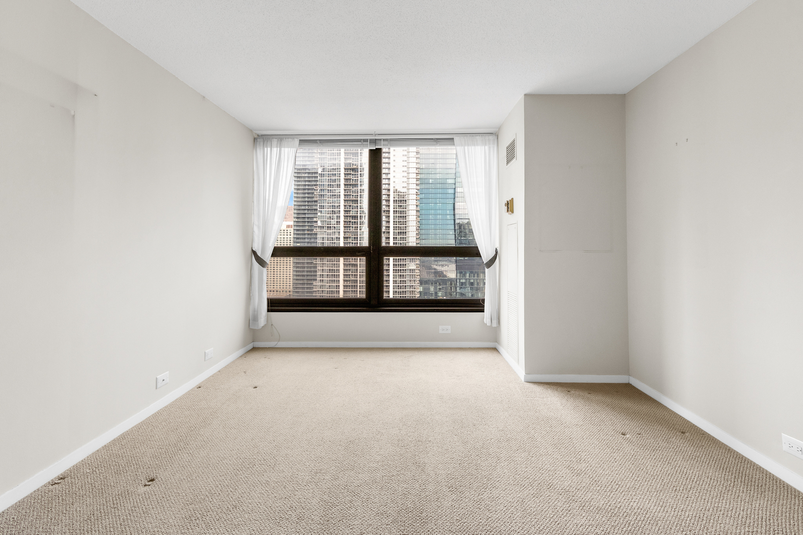 360 East Randolph Street, Unit 2307 Chicago, IL 60601 - Photo 16 of 34 an empty room with windows