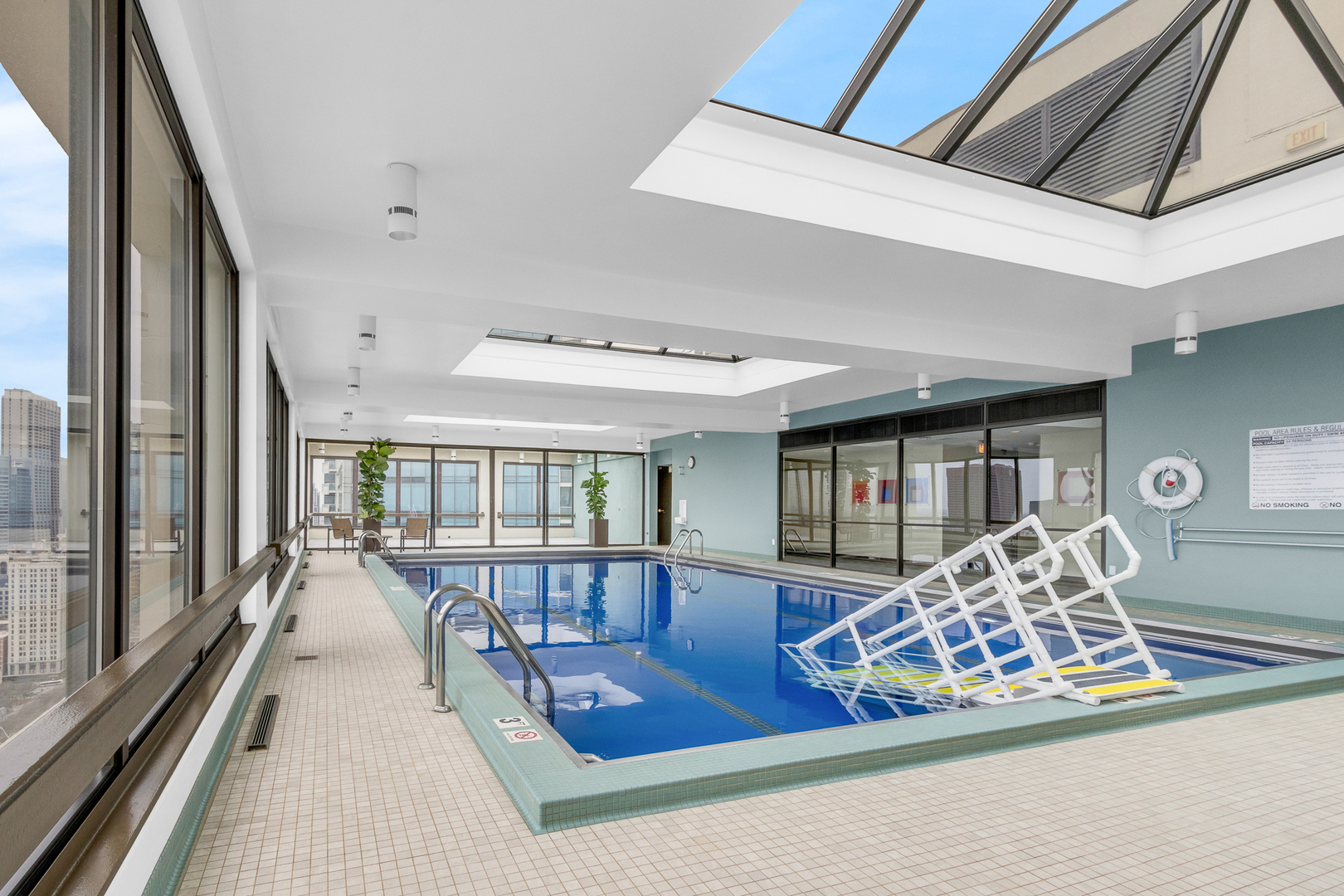 360 East Randolph Street, Unit 2307 Chicago, IL 60601 - Photo 26 of 34 a living room with furniture large window and wooden floor