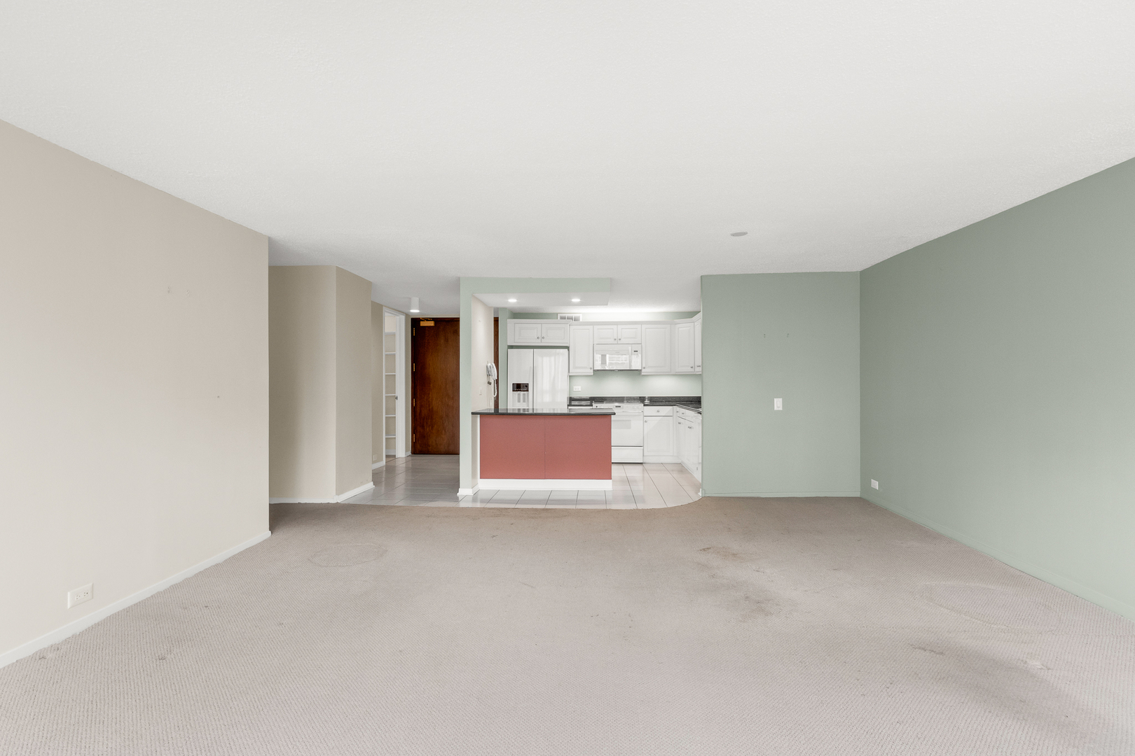 360 East Randolph Street, Unit 2307 Chicago, IL 60601 - Photo 6 of 34 a view of a kitchen with a sink and cabinets